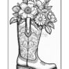 A decorative cowboy boot filled with an assortment of flowers, featuring intricate floral patterns on the boot itself.