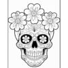 A decorated skull surrounded by flowers, featuring intricate designs and patterns.