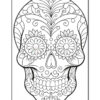 A detailed black and white coloring page of a skull decorated with floral patterns and intricate designs.